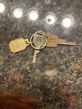 Vtg Oldsmobile GM Dealer Door Trunk Ignition Key Set Returnable Fob picture