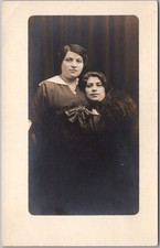 c1910s STUDIO Photo RPPC Postcard 2 Young Women / Sisters ? Black Background picture