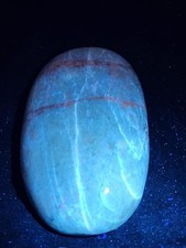 Gorgeous Natural UV Reactive Hackmanite Palm Stone picture