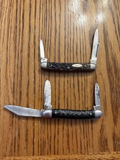 2 vintage multi-blade folding pocket knives with black synthetic jigged handles. picture