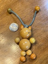 VNTG TYKIE BAKELITE Baby Crib Toy Figural Kitty Cat Beads Articulated 30's 40's picture