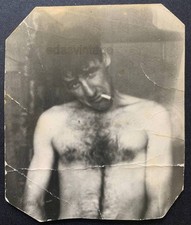 Guy smoks cigarette Handsome shirtless man Hairy chest Bare torso photo Gay Int picture
