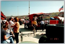 Vtg Color Snapshot NASCAR Pit Row Race Track Pit Crew Man Bicycle 2001 picture