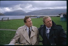 British actors Roger Moore and Michael Caine brave typically gray - Old Photo picture
