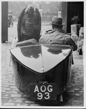 Man carries a statue of an Angel in his automobile He has bought t- Old Photo picture