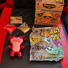 Fuggler Gold Figure Exclusive Red/Pink Plastic Figure w/ Accessory (Opened) picture
