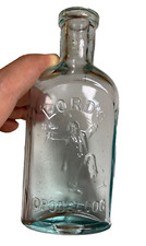 PRISTINE Antique LORD'S OPODELDOC Bottle Embossed Man Breaking Crutches NEW York picture