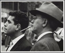 Photo:Two Men Smoking Cigars 1950s Crowd Portrait Black and White picture