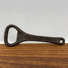 Vintage Mineral Waters Cast Iron Bottle Opener picture