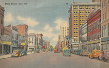 Erie Pa State St Looking North To Bay From 12th St Storefronts Postcard picture