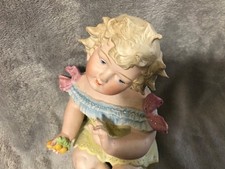 ANTIQUE CONTA & BOEHME PIANO BABY HOLDING CHERRIES picture