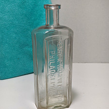 Henry K. Wampole & Co Philadelphia PA Clear Embossed Glass Medicine Bottle picture
