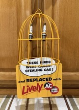 AC Spark Plug Bird Cage Caught Stealing Gas Station Oil Sign Vintage Style Decor picture