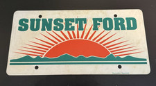 Sunset Ford Dealership Booster License Plate Thin Plastic picture