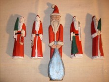 Folk Art Carved Santa Figures. Unique, hand-crafted, solid wood, varied poses. picture
