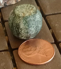 Small Green Mottled Spherical Stone Rock Mineral Specimen - Penny for Scale picture