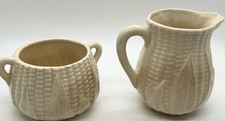 Vintage ceramic creamer and a matching open sugar bowl picture