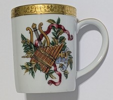 R.H. Macy Royal Gallery Gold Buffet Christmas Music Coffee Mug 1991 picture