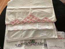 7 Vintage Embroidered/cutwork Pillowcases 3 pairs and 1 picture