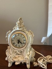 vintage ceramic or porcelain electric mantel clock, likely featuring a Lanshire  picture