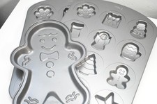 3 pans: WILTON CHRISTMAS COOKIE PAN - 12 SHAPES and Gingerbread Man picture