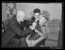 Blanch NC 1940 Dr S.A. Malloy Examining Bobby Willis at Home FSA Borrower picture