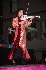Violinist Vanessa Mae performs outside the Shanghai Tang store at - Old Photo picture