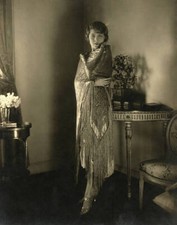 Hungarian film actress Vilma Banky standing near a table with a 1930s Old Photo picture