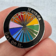 Vintage Nevada Bet On It Rainbow Wheel Enamel Pin Black Silver Casino Souvenir picture