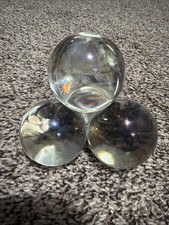An Old Clear Glass Paperweight Whose Design is Four Round Balls picture