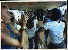 1993 Press Photo Volunteers at Camp Paradise dancing during lunch break, Cuba picture