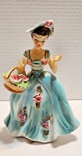 VINTAGE PORCELIAN YOUNG GIRL WITH BASKET OF FLOWERS SHE IS LOVLY FROM THE  1950' picture