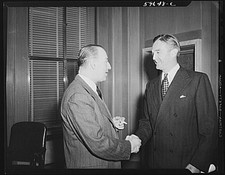 Washington DC 1930s Handshake Between Two Men in Suits Office Interior picture