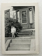CUTE LITTLE GIRL IS HOLDING A DOLL~VINTAGE 1950's PHOTO 4.5'' X 3.5'' picture