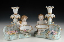 Porcelain pair of candleholders or candlesticks, Merman Children. picture