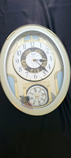 Small World RHYTHM Oval Analog Musical Wall Clock, 12 Melodies + 3 Christmas picture