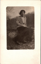 Postcard Real Photo RPPC Woman Sitting on Rock Wearing Sweater Unposted picture