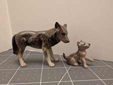 Retired Hagen Renaker Mama Wolf and cub picture