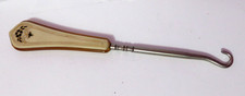 VINTAGE CELLULOID OR LUCITE BUTTON HOOK picture