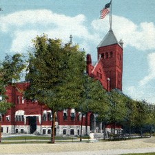 c1910s La Crosse, WI City Hall Postcard Red Brick Architecture Flag Cannon Vtg picture