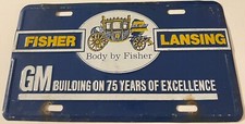 Body By Fisher Booster License Plate Lansing Michigan GM General Motors 75 Years picture