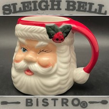 Sleigh Bell Bistro Blue Eye Winker Santa Ceramic Mug c2004 China 4.25