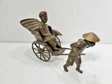 Solid Metal Man Pulling Cart  picture