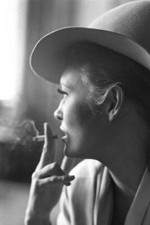 Faye Dunaway smoking a cigarette and wearing a felt hat Old Photo picture