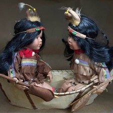 Cathay Collection Native American-Inspired Porcelain Dolls in Canoe 1 of 5000 picture