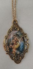 Lacy Festooned Filigree Mary Madonna Caressing the Child Jesus Goldtone Necklace picture