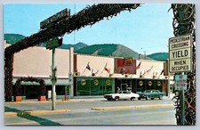 K61/ Afton Wyoming Postcard Chrome Elk Antler Arch Stores Cars 199 picture