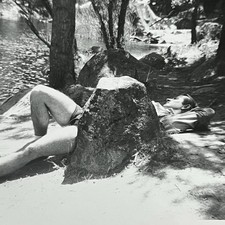 Vintage B&W Snapshot Photograph Handsome Man Laying Outside Behind Rock Shorts picture