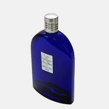 Empty Vintage Cobalt Blue Bottle of Eau de Cologne, Soir de Paris. picture