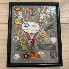 Framed Collection of Toys-R-Us 1999 Employee Pins and Memorabilia Some Rare  picture